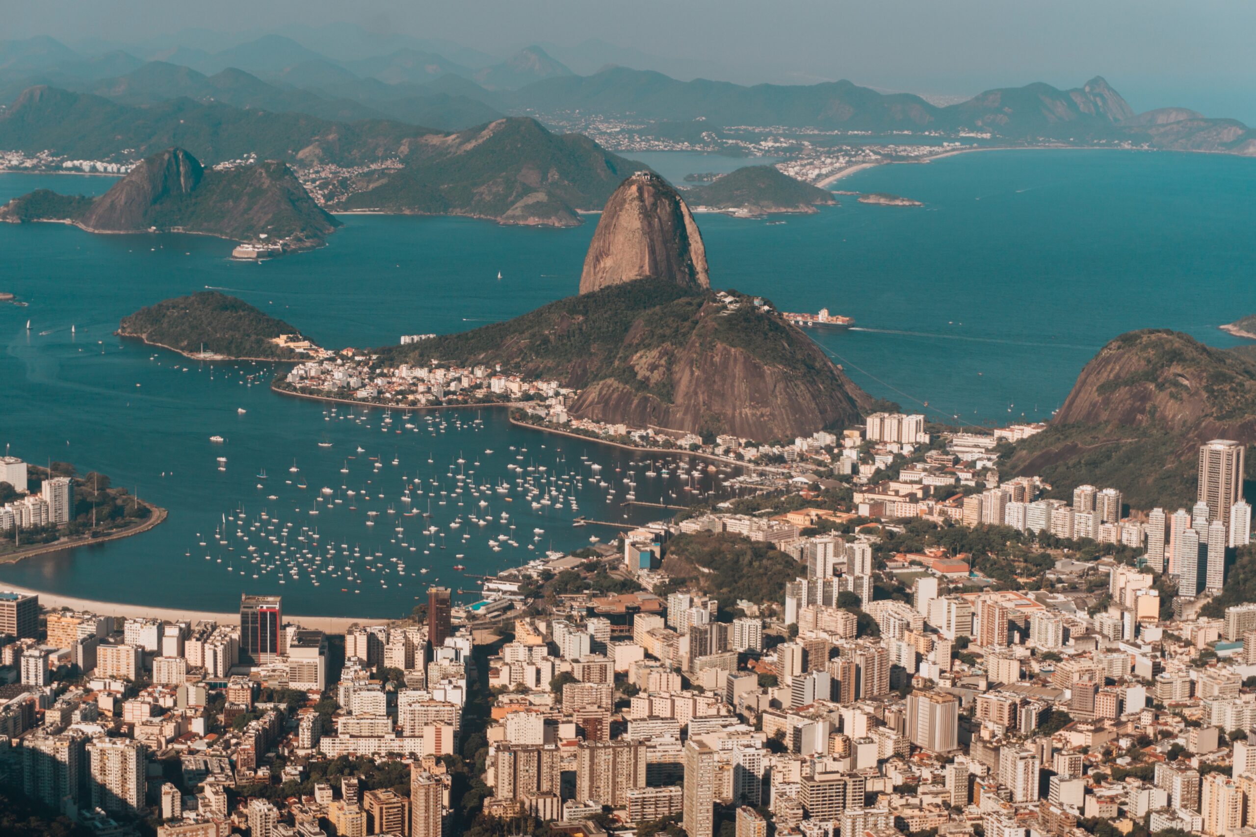 Aerial Photo Of Rio De Janeiro Surrounded By The Sea And Hills Under The Sunlight In Brazil - PV Assessoria Contábil | Contabilidade no Rio de Janeiro