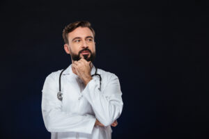 Portrait Of A Pensive Male Doctor - PV Assessoria Contábil | Contabilidade no Rio de Janeiro